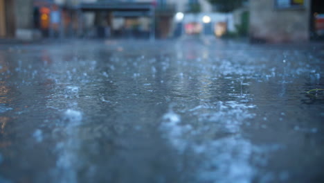 Rain-drops-in-Montpellier-streets-close-up-view-France-slow-motion